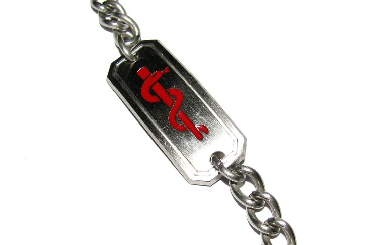 A photo of a medic alert bracelet.