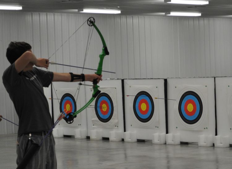Youth practice archery skills at MSU’s John and Marnie Demmer Shooting Sports Education and Training Center.