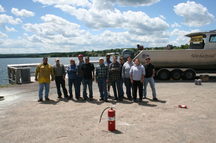 Drill Conductor Training course attendees are shown with instructors at Keweenaw Bay Indian Community location. Below, the Red Cliff Band of Lake Superior Chippewa location class. Photos: Jim Thannum, Great Lakes Indian Fish and Wildlife Commission