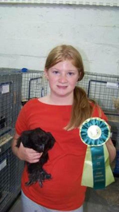 LaBean and her chicken with her winning ribbon.