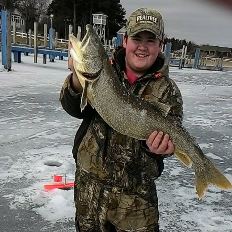Lake Huron offers a diversity of great fishing opportunities in all seasons, such as this lake trout caught through the ice in the Port Sanilac Harbor. Photo: Logan Miller