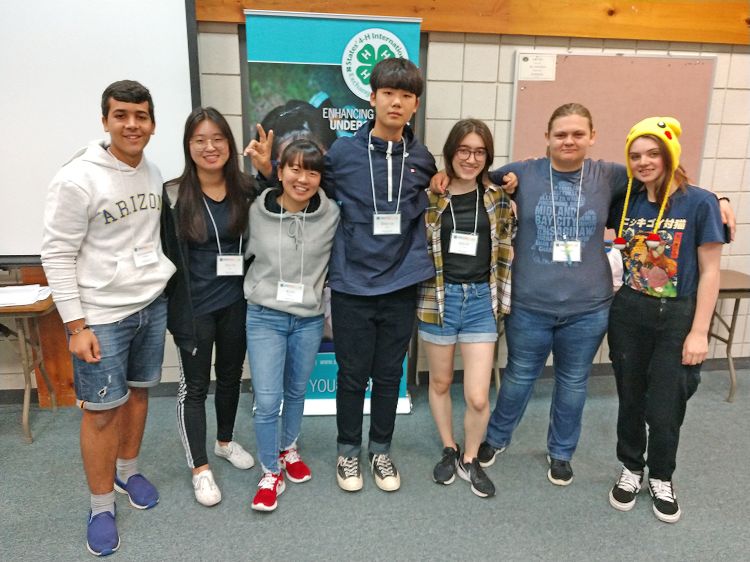 Exchange students pose for group photo