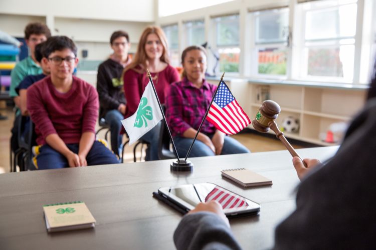 Youth in a 4-H club meeting