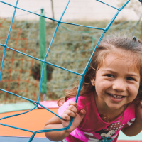 Girl on jungle gym