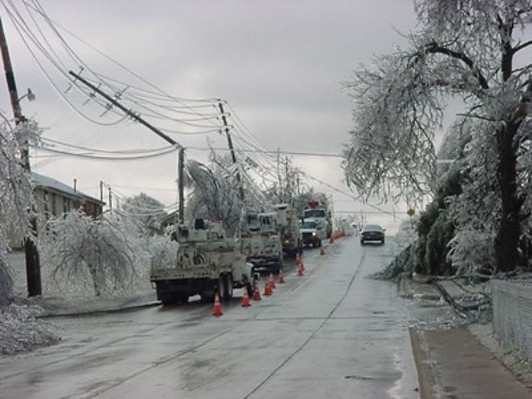 Vehicles on a street after an ice storm.
