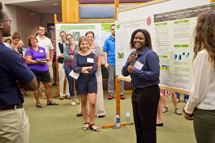 People presenting at W.K. Kellogg Biological Station.