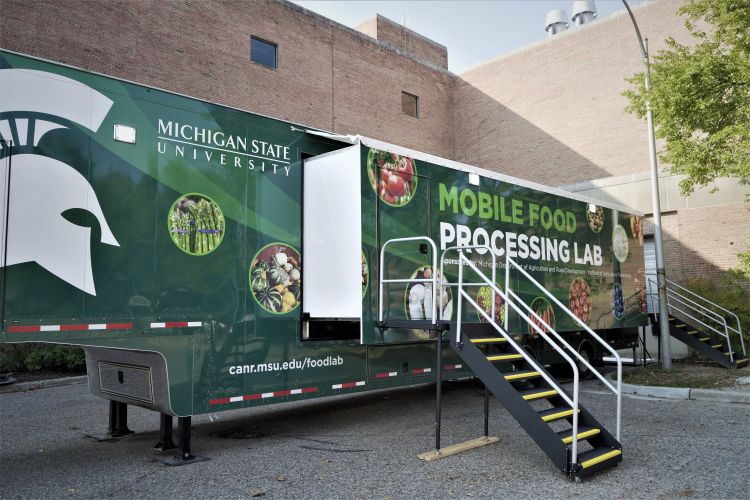 Photo of a 54-foot trailer that houses a food processing lab for MSU.