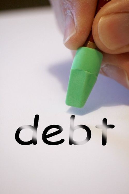 eraser on the word debt