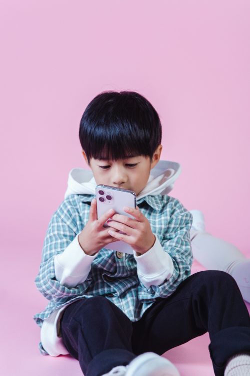 Boy looking at cell phone