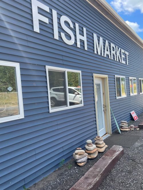 The front of the retail store of Vandlandschoot's and Sons Fishery in Munising, Michigan is shown.