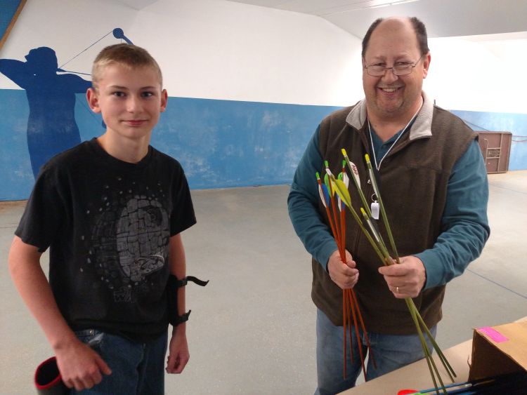 Erick Kestila, right, with a participant in the 4-H After School Archery Program in Delta County.