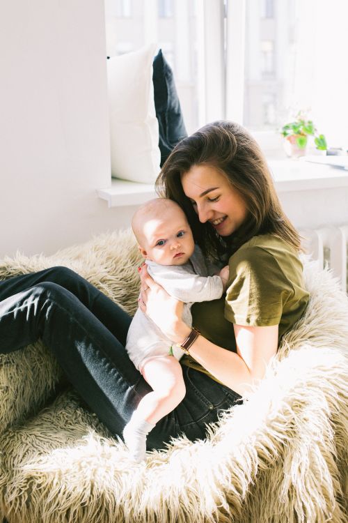 Teen girl holding a baby