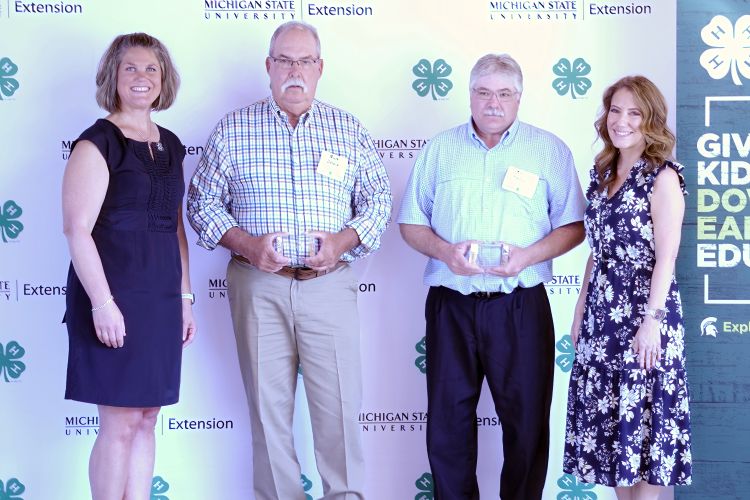 Kevin Yeager and Rick Gould accepting their awards.