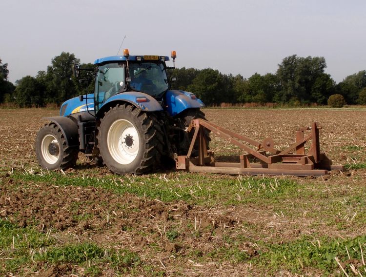 Mole drains are created by dragging a bullet-shaped cylinder through the soil behind a deep-tillage shank, creating an underground conduit for water flow. Photo by Michael Trolove.