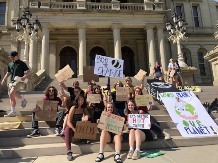 Lauren and friends engaged in community engagement at the Michigan State Capitol.