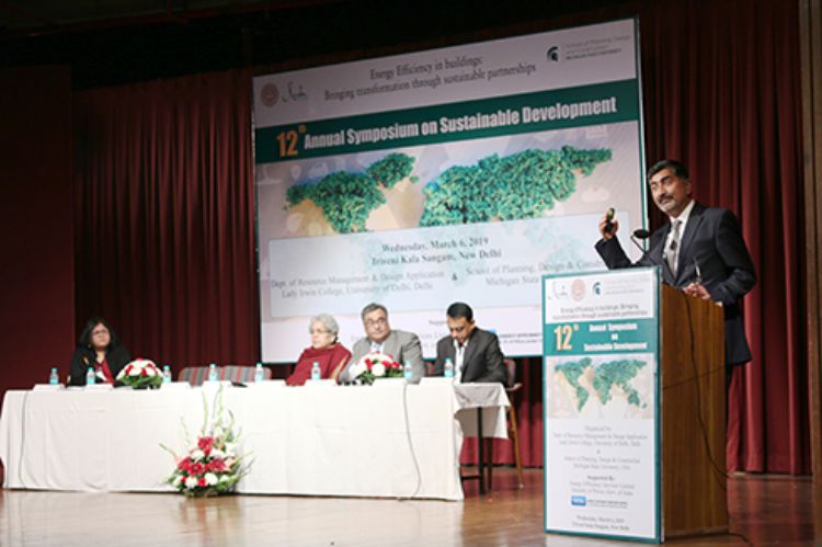 Image of Matt Syal presenting at the Symposium in India.