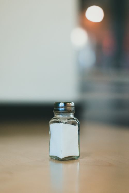 A salt shaker on a table.