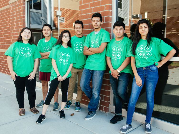 A group of Latinx youth in 4-H apparel.