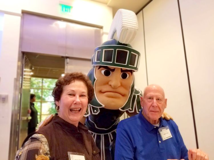 Leighton and Peggy Miller standing next to Sparty