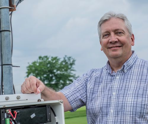 MSU researcher Jeff Andresen at an Enviroweather station.