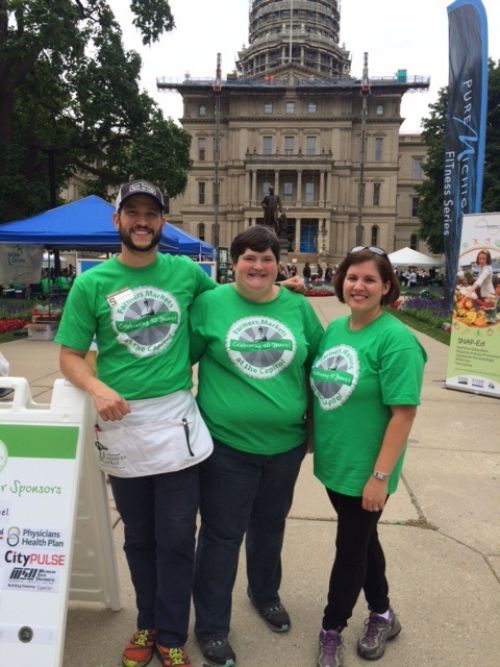MSU Extension staff members working at MIFMA’s August 27, 2015 Farmers Market at the Capitol. Pictured from left to right: Extension Educators Garrett Ziegler, Julie Darnton, and Kendra Wills.