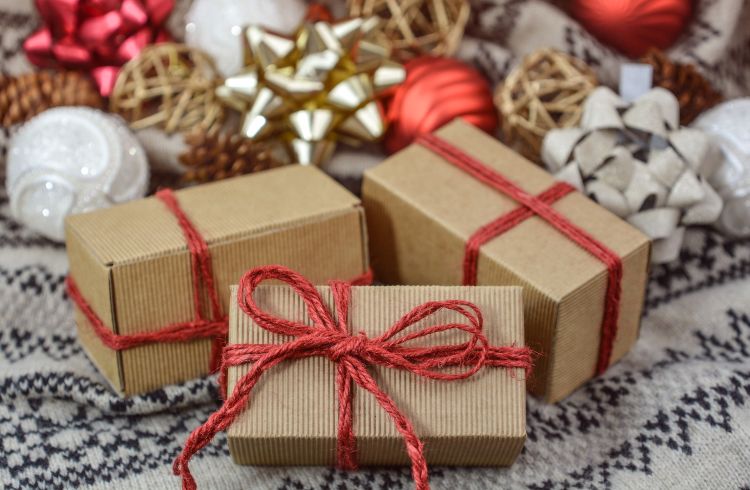 Presents wrapped in brown paper with red ribbons.