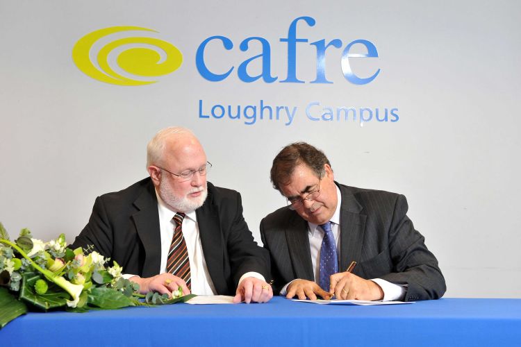 CANR's Fred Poston and CAFRE's John Fay sign agreements in March 2014