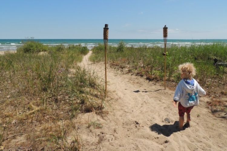 Narrow pathways to the beach allow for scenic access to waterfront while protecting critical coastal habitats. Brandon Schroeder | Michigan Sea Grant