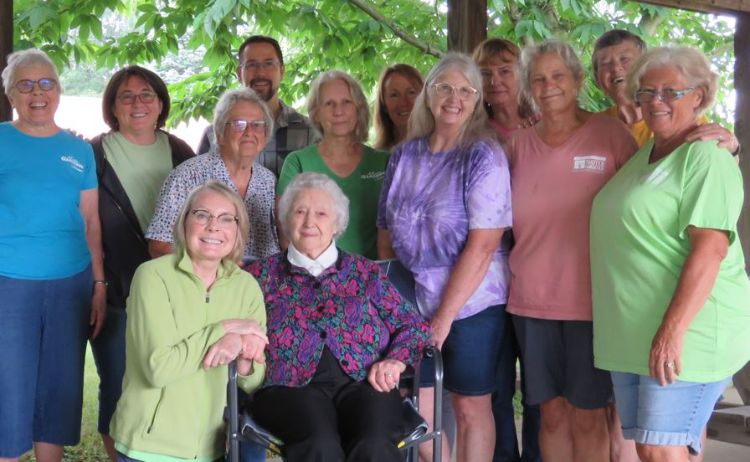 Flora Phelps surrounded by her friends.