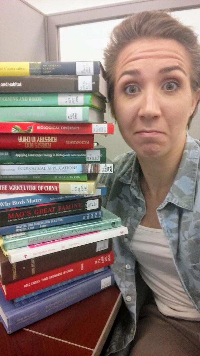 Ciara Hovis with stack of books