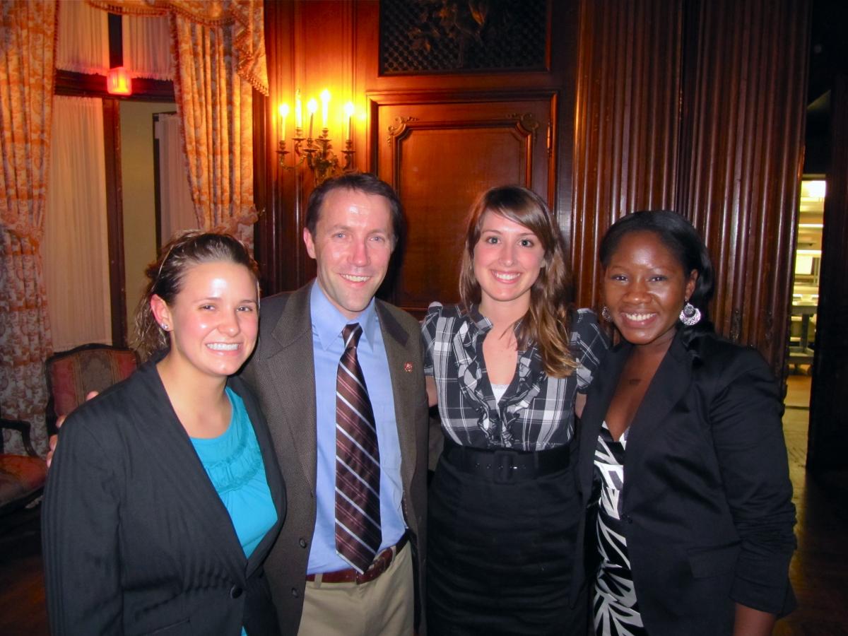 Deputy Undersecretary of Agriculture Jay Jensen is being flanked by Sarah Savoie, Virginia Borcherdt, and Sarah Oyetubo