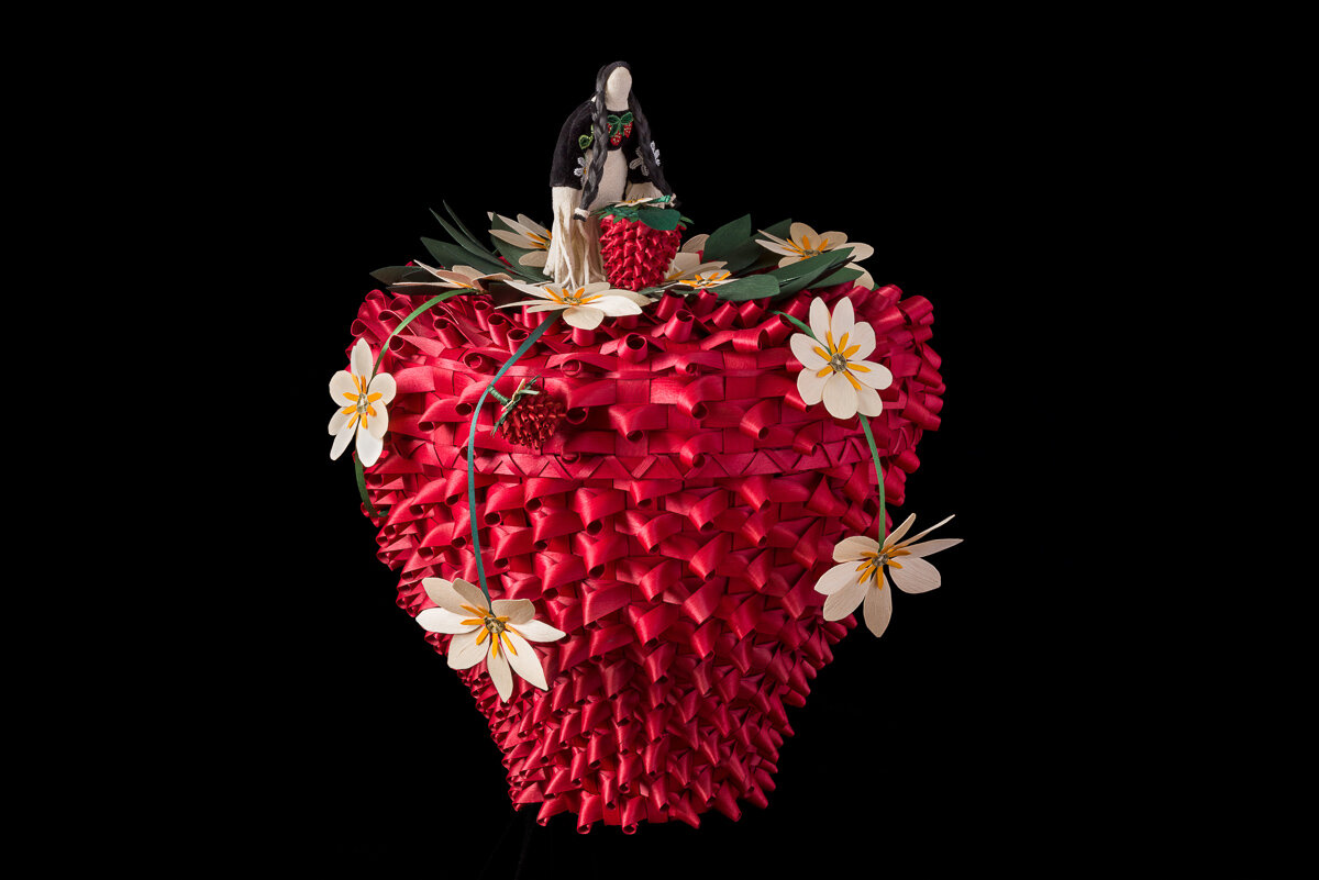 Black ash basket shaped like a strawberry.