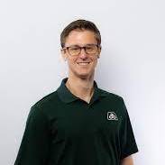 Mike Swoish Dressed in Spartan Polo Shirt,  Eyeglasses Smiling