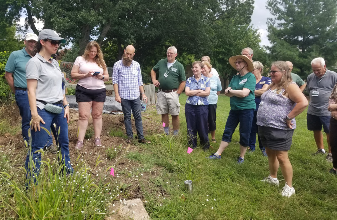 A group of gardening participants learning about gardening