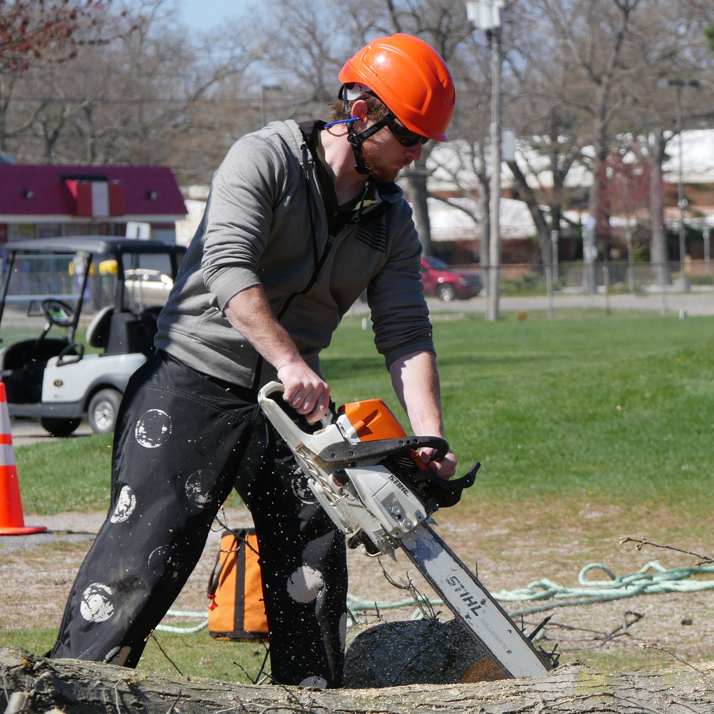 Student using a chain saw