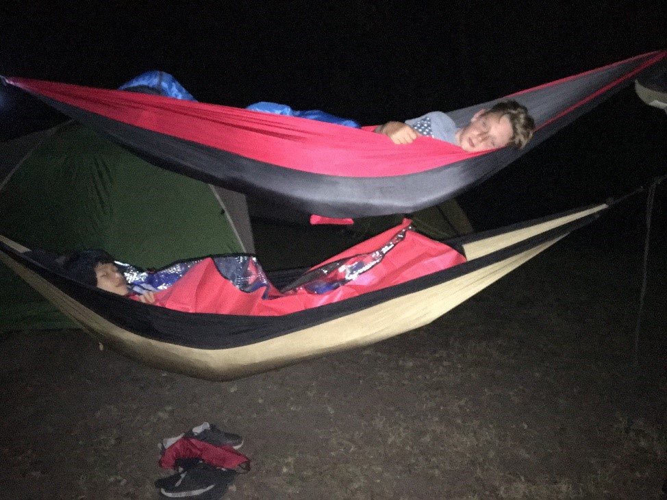 Youth sleeping in hammocks