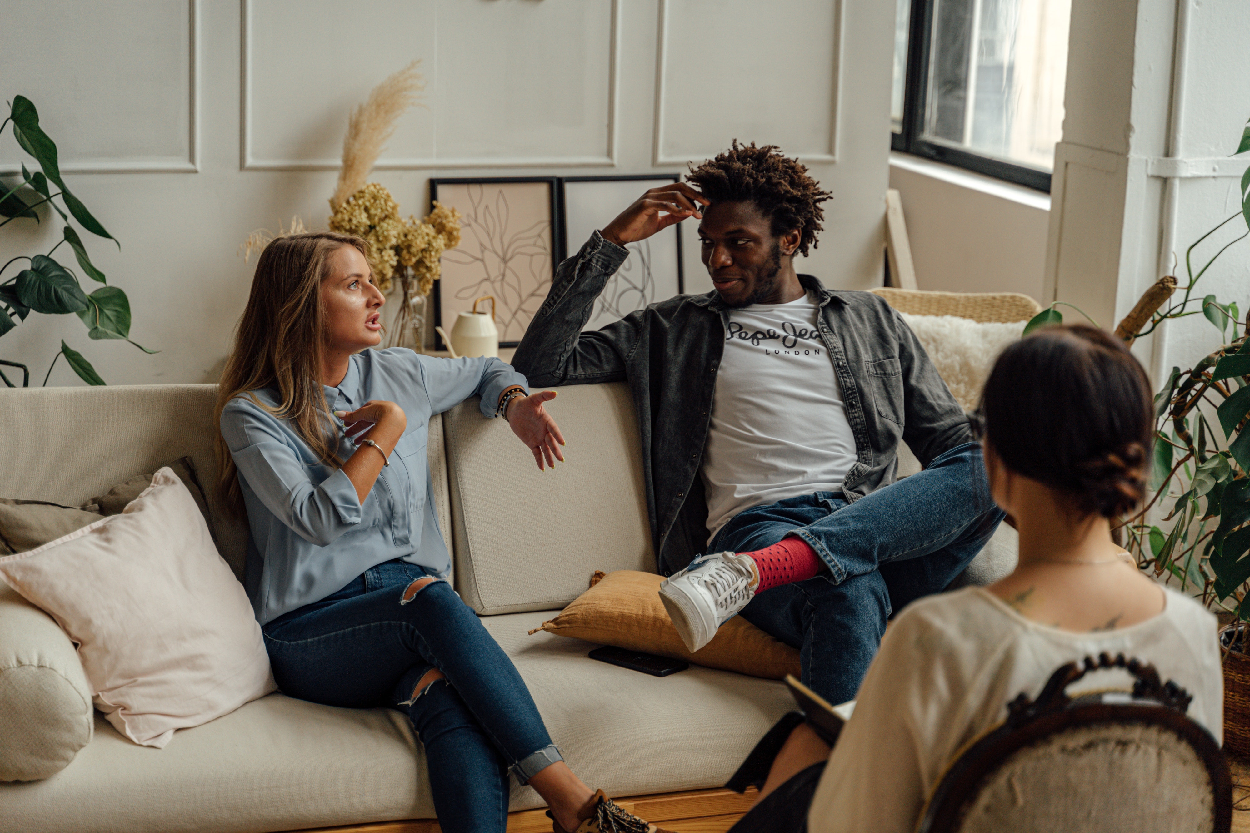 A picture of three people talking