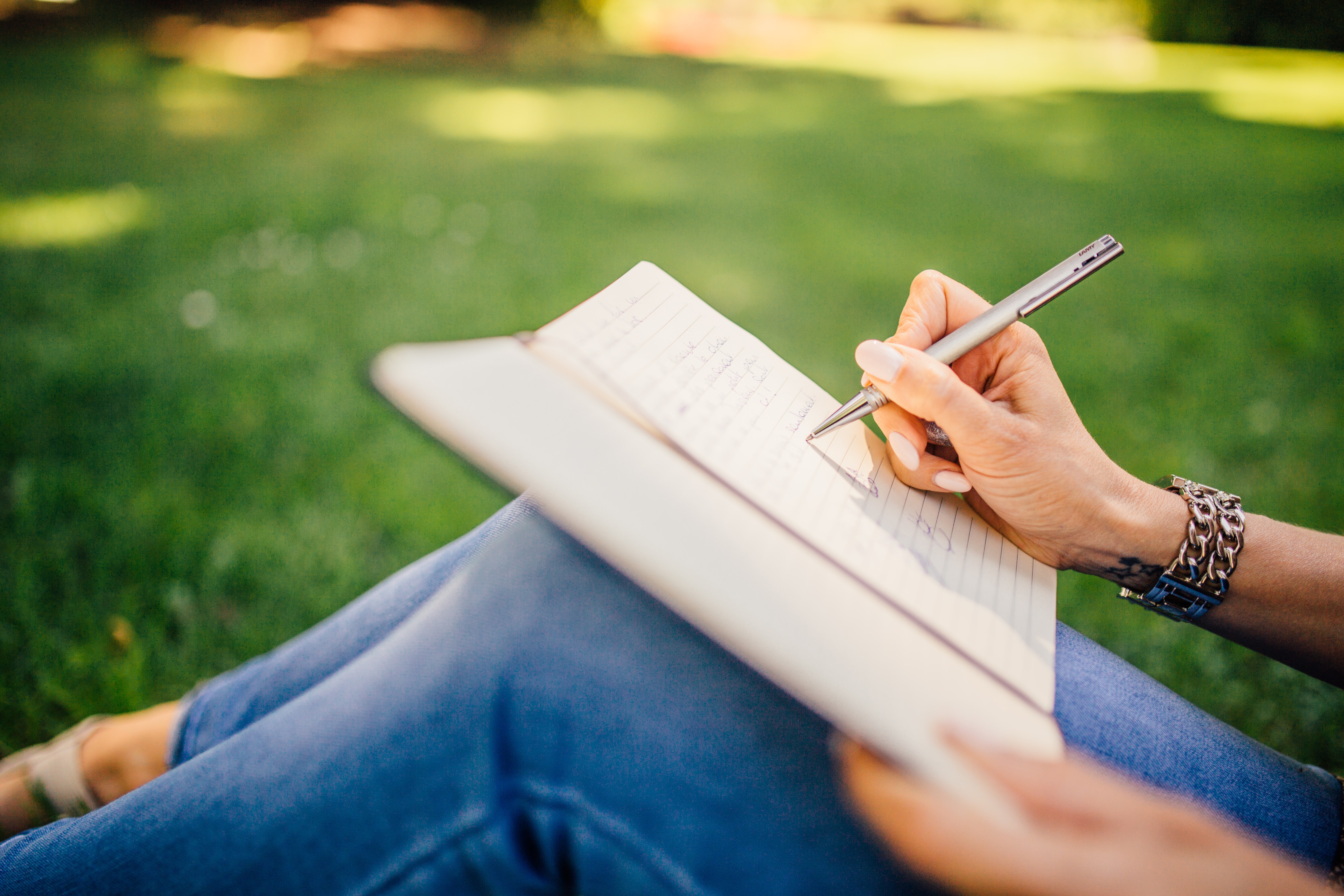 A picture of someone writing in a journal