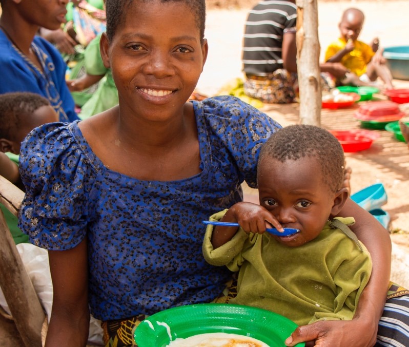 A mother and her child sitting down