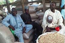 three men at a market