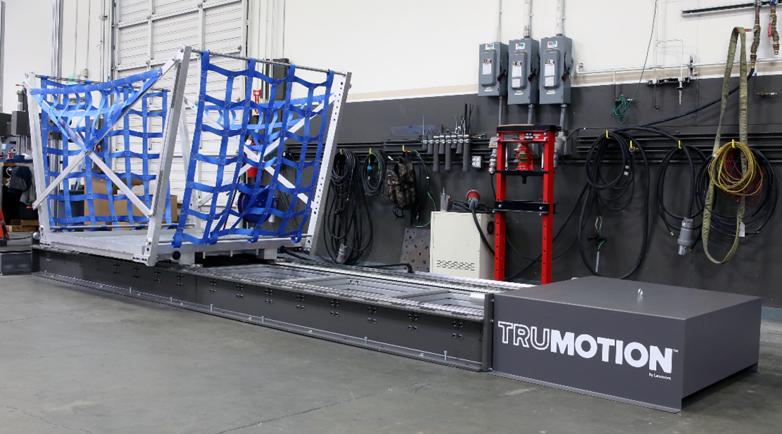 Lansmont TruMotion Sled. Industrial testing equipment that simulates acceleration in a warehouse-type room.