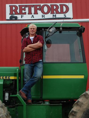 Adam Retford on a tractor at Retford farms.