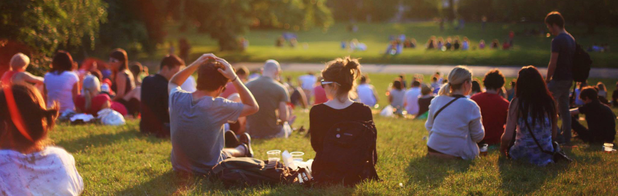 Group of people outside enjoying a music concert.