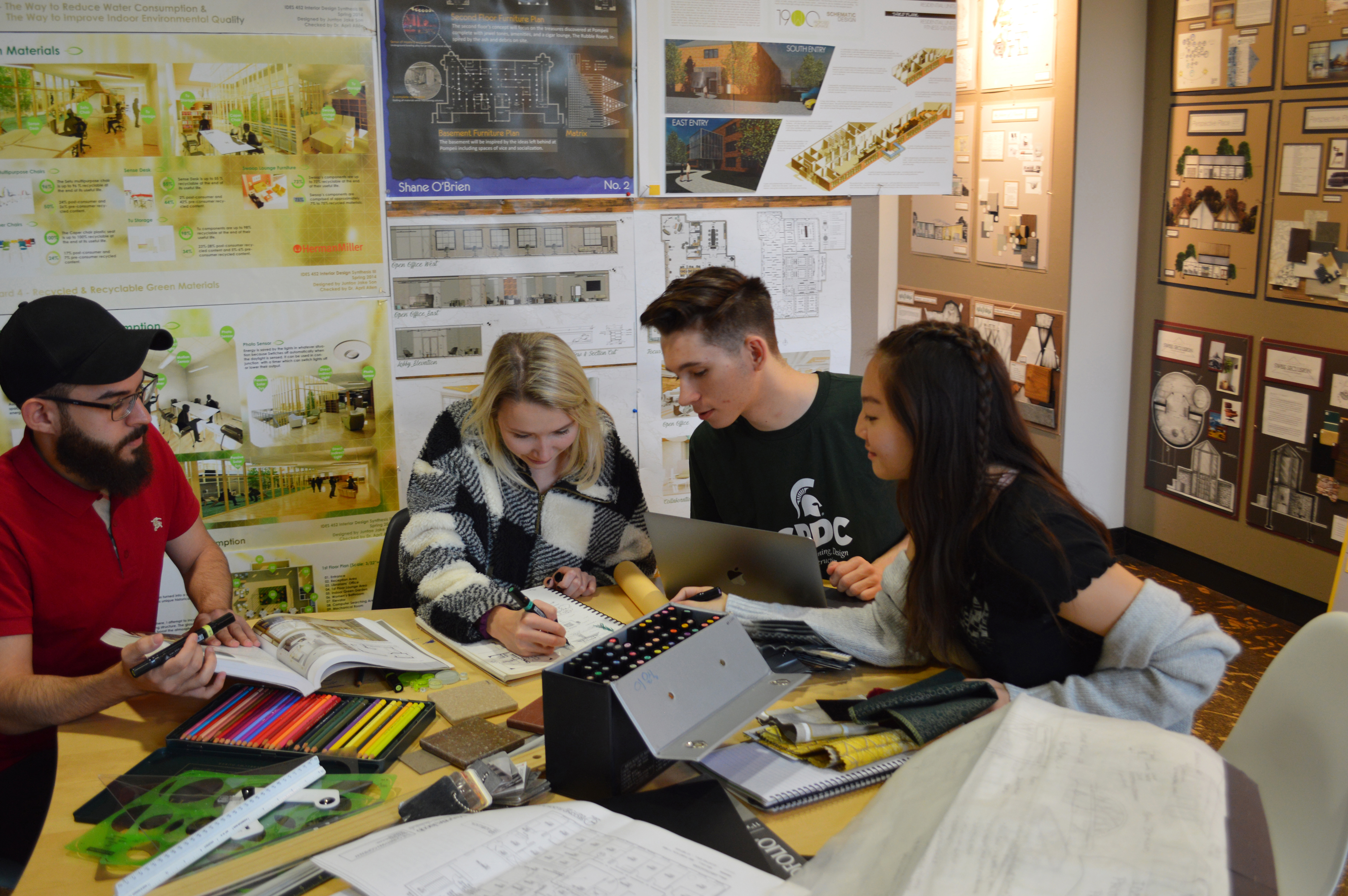 Interior design students working on a project together.