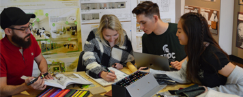 Four students meet and discuss specifics about an interior design project.