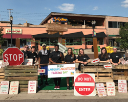 LA students at their Park(ing) Day display in East Lansing.