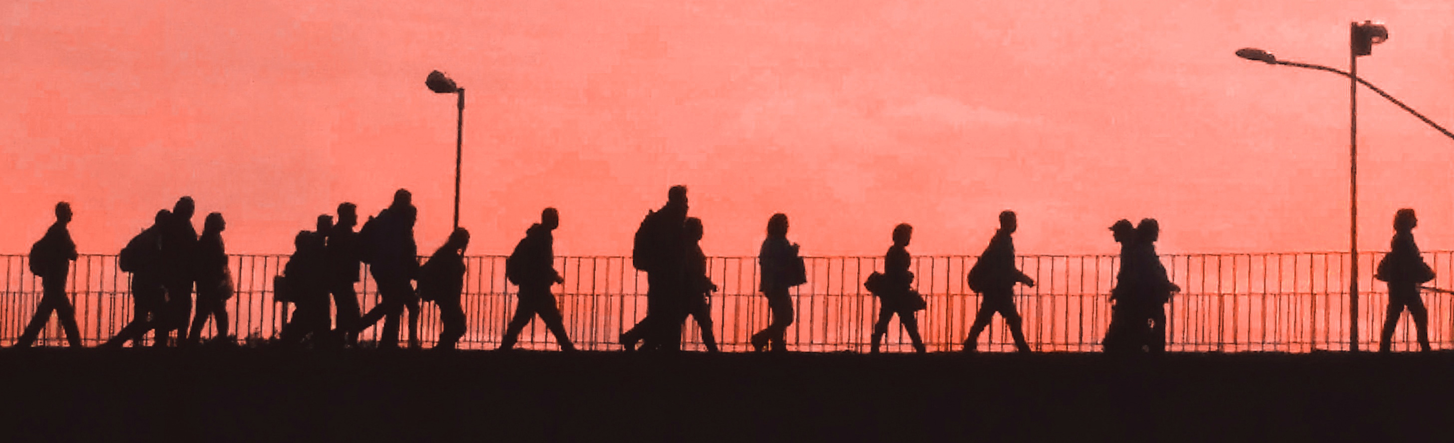 People walking on bridge.