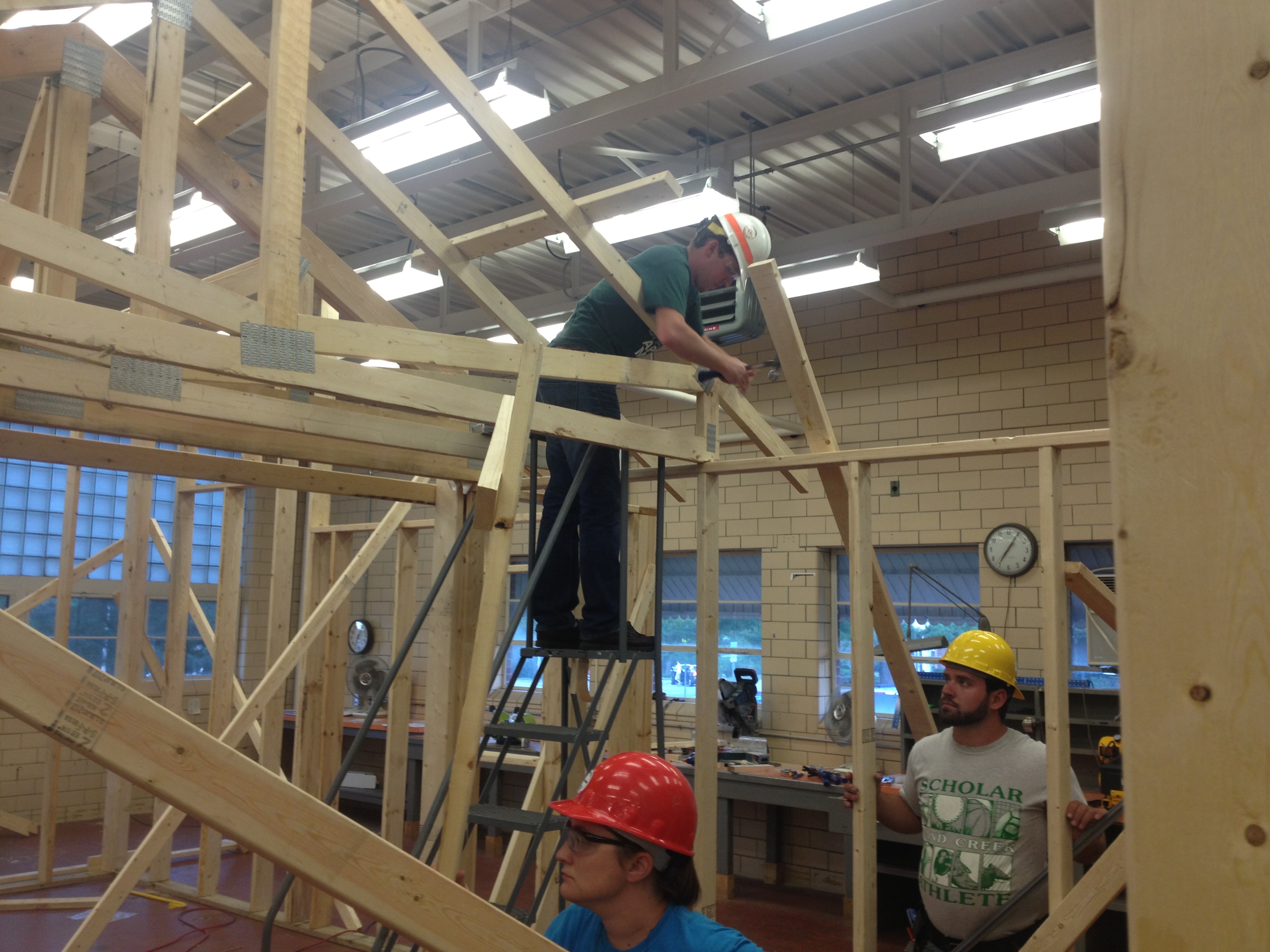 Students putting up a wall frame in the Construction Management Lab.