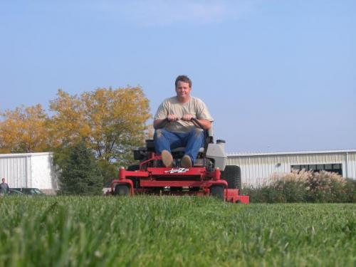 'Person mowing lawn'