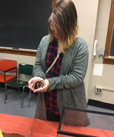 Girl holding spider